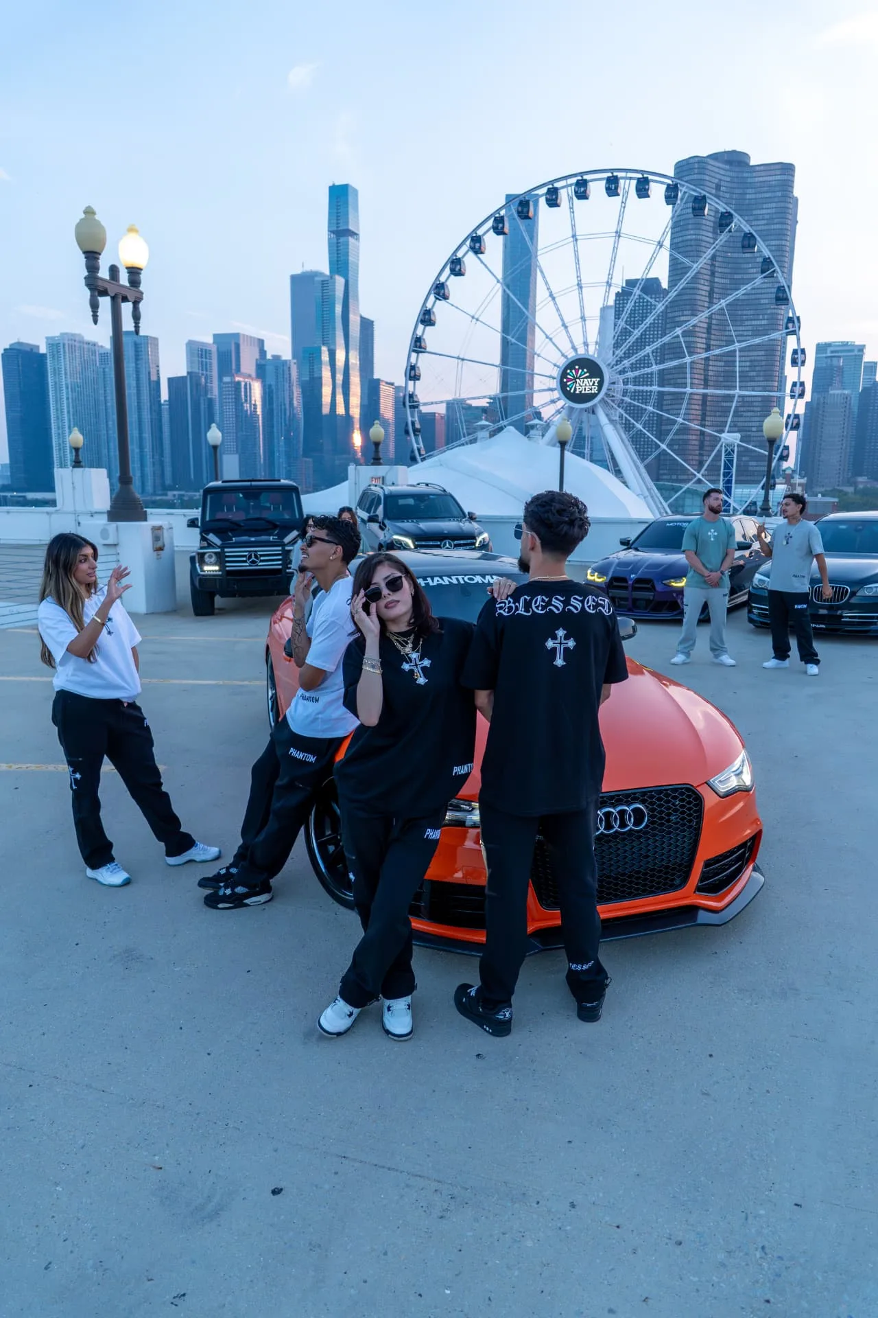 Crew in PHANTOM4 Blessed tees and cargo pants with the orange Audi at Navy Pier